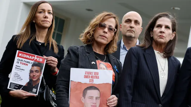 Yael Alexander, Orna Neutra, Adi Alexander and Liz Naftali stand outside the White House hosting posters