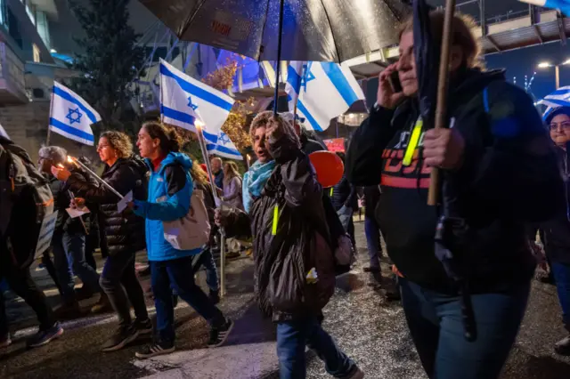 Families of the hostages in Gaza join with members of the public in an evening march and protest around the Knesset to demand the government work to secure their return on December 12, 2023 in Jerusalem.