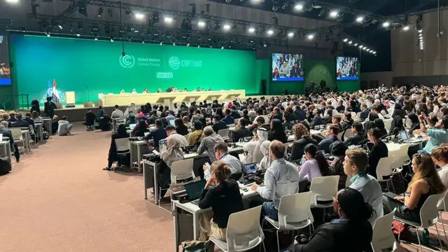 People gathered in the room at COP28