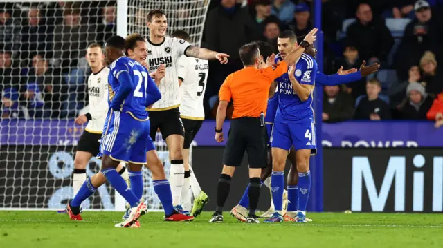 Conor Coady complains to referee