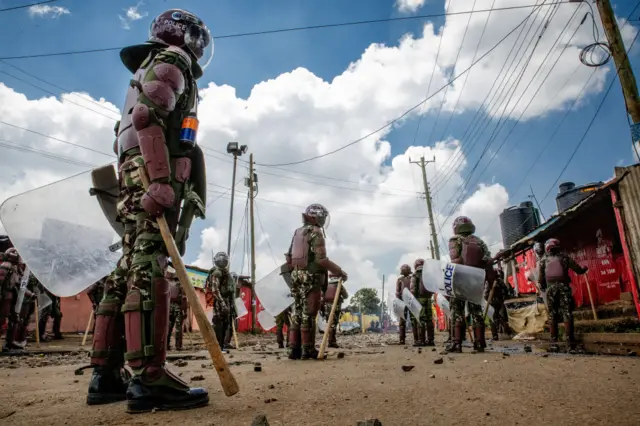 Anti-Riot police officers stand guard during a mass demonstration called by the opposition leader Raila Odinga in Kibera Slum on March 27, 2023 in Nairobi, Kenya.