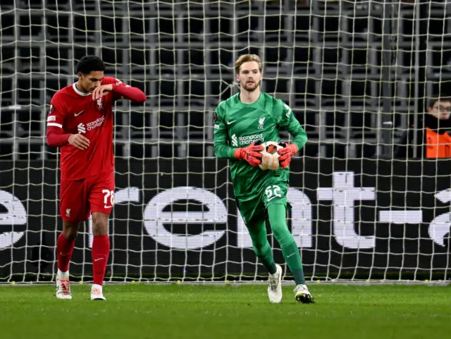 Caoimhin Kelleher of Liverpool holds the ball in their hands