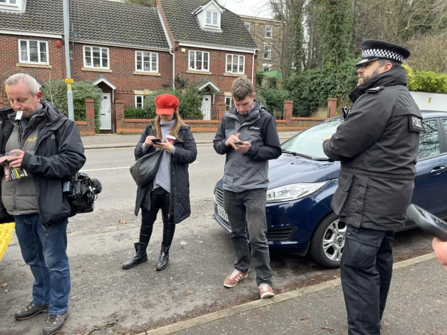 Journalists gathering ahead of a press conference in Norwich