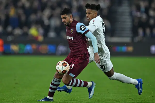 West Ham's Emerson battles with Freiburg's Junior Adamu for the ball