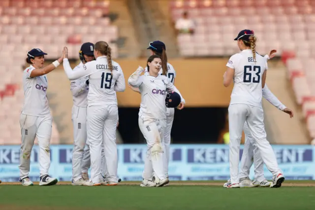 England players embrace at the end of day one