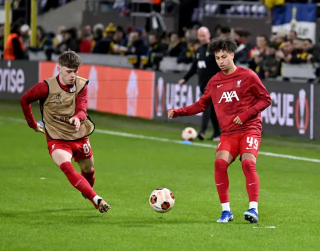 Kaide Gordon and Conor Bradley of Liverpool during the warm-up