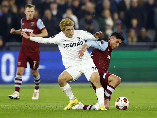 SC Freiburg's Ritsu Doan in action with West Ham United's Edson Alvarez