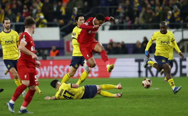 Cody Gakpo of Liverpool is challenged for the ball