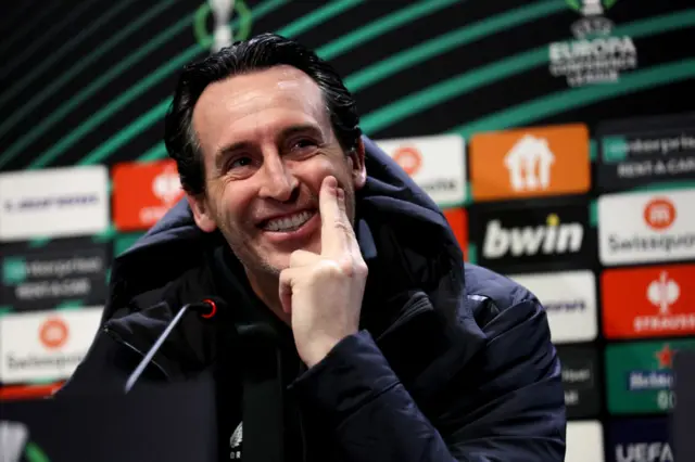 Unai Emery smiles during a press conference