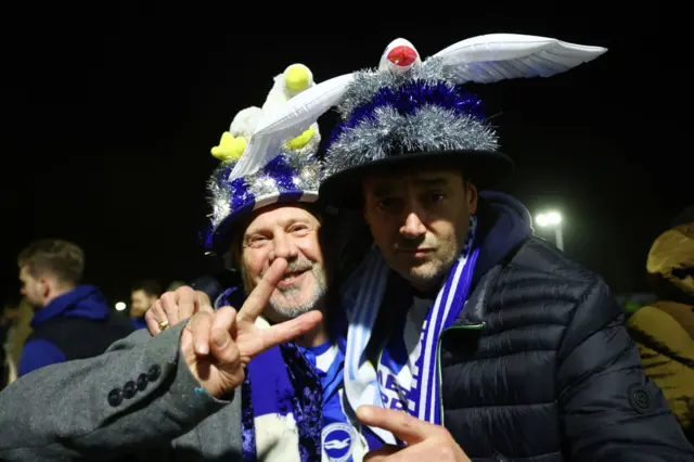 Brighton fans wearing hats with seagulls on them