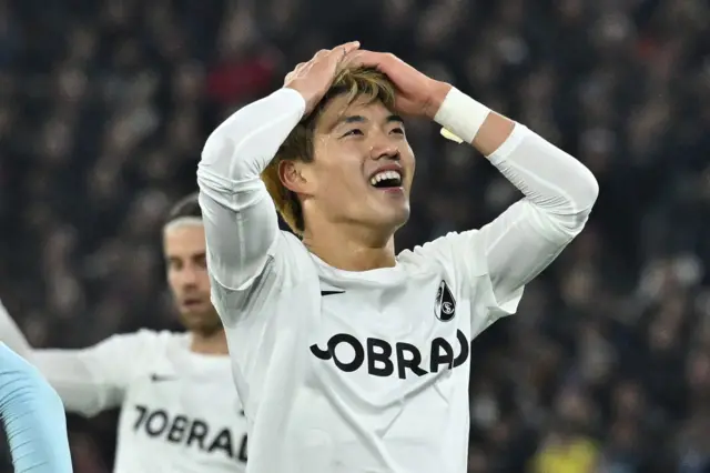 Ritsu Doan has his hands on his head in disbelief