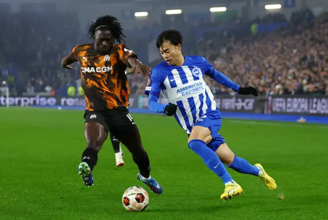 Brighton & Hove Albion's Kaoru Mitoma in action with Olympique de Marseille's Bamo Meite