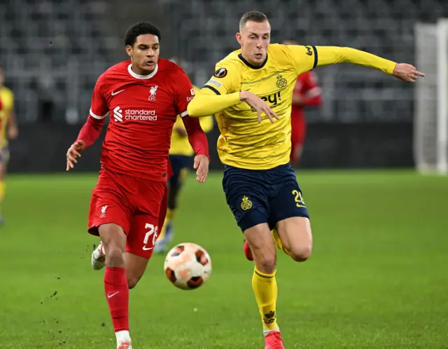 Jarell Quansah of Liverpool and Gustaf Nilsson of Union Saint-Gilloise challenge for the ball