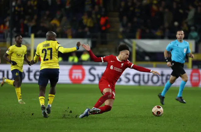 Union Saint-Gilloise's Noah Sadiki in action with Liverpool's Kaide Gordon