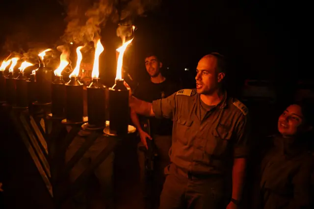 Israeli soldiers light Hanukkah candles