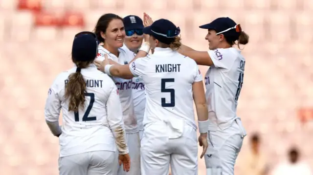 England celebrate a wicket