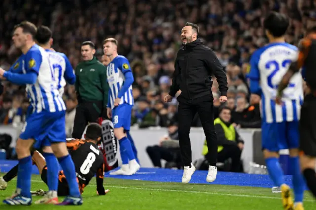 Roberto De Zerbi jumps and screams on the touchline