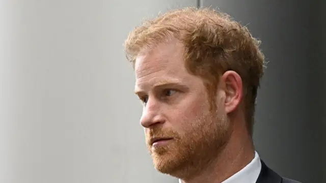 Prince Harry, Duke of Sussex walks outside the Rolls Building