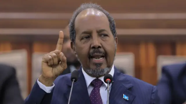 Somalia's President Hassan Sheikh Mohamud gestures during his address to the opening of the third session of the 11th Parliament at the Somali Parliament in Mogadishu on May 29, 2023.