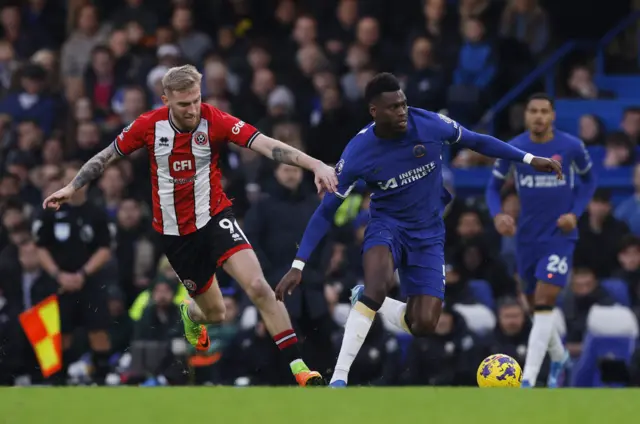 Chelsea's Benoit Badiashile in action with Sheffield United's Oli McBurnie