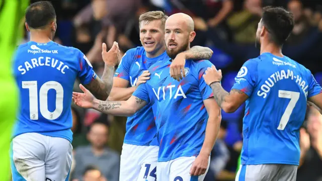 Paddy Madden celebrates scoring for Stockport