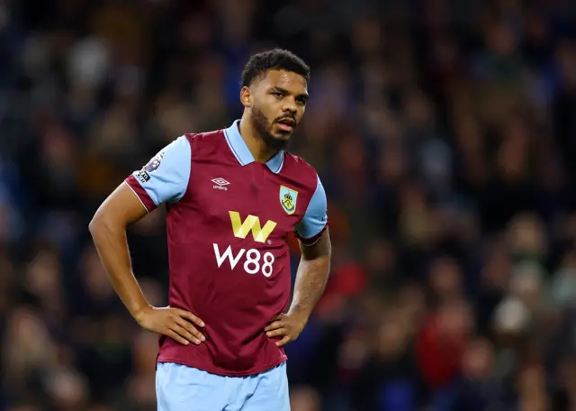 Burnley's Lyle Foster with his hands on his hips in exasperation