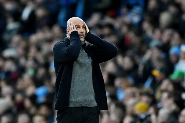 Pep Guardiola, Manager of Manchester City, reacts