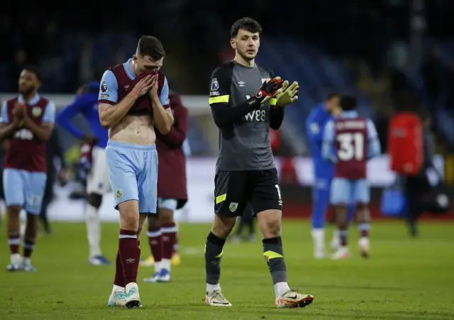 Burnley's James Trafford looks dejected as he applauds fans after the match