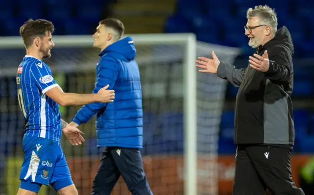 Craig Levein greeting game-winner Graham Carey with a big smile following full-time.