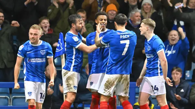 Kusini Yengi celebrates with team-mates in Portsmouth's win over Bolton