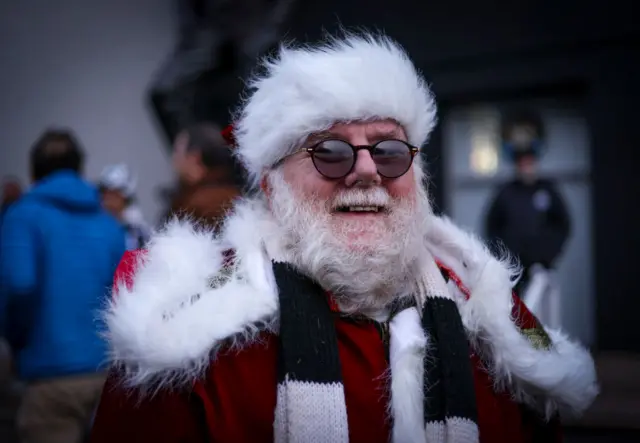 Man dressed as Santa Claus in Newcastle black and white colours