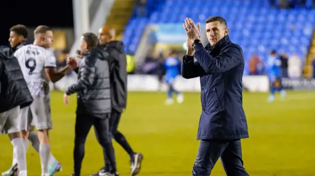 John Mousinho claps the Portsmouth fans