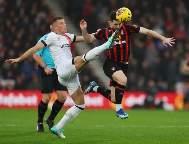 Luton Town's Ross Barkley in action with AFC Bournemouth's Lewis Cook