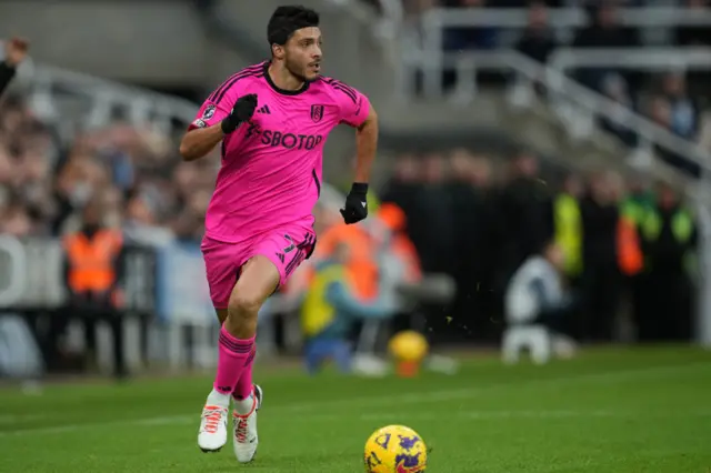 Raul Jimenez runs with the ball