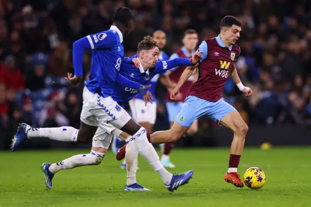 Zeki Amdouni of Burnley gets past Dwight McNeil of Everton