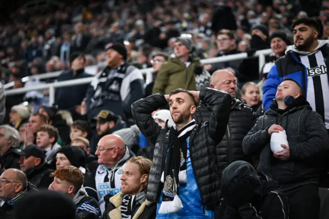 Newcastle fans look disappointed in the fans