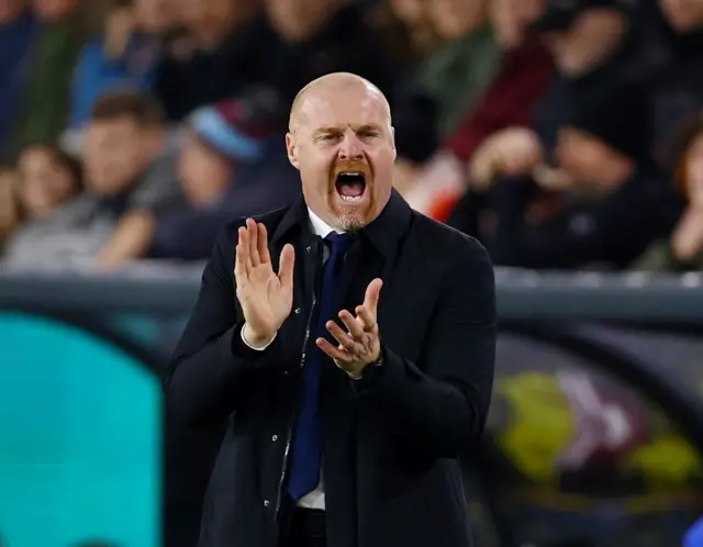 Dyche shouts and applauds the effort of his players.