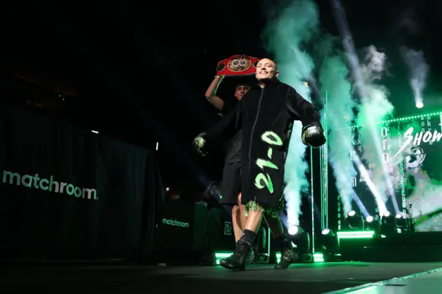 Sunny Edwards smiles as he makes his ringwalk