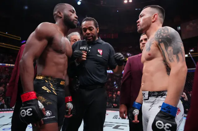 Leon Edwards and Colby Covington opposite in the cage