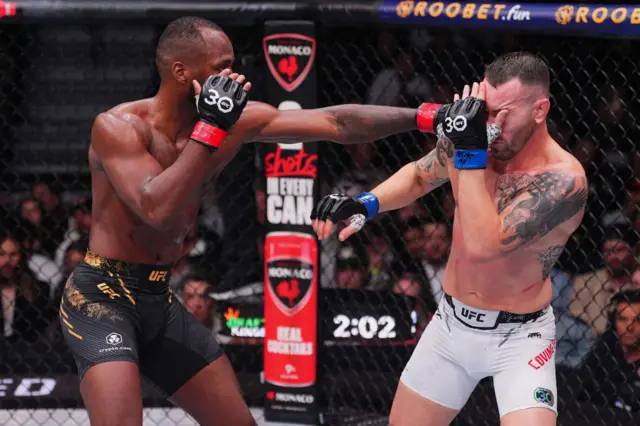 Leon Edwards lands a punch on Colby Covington