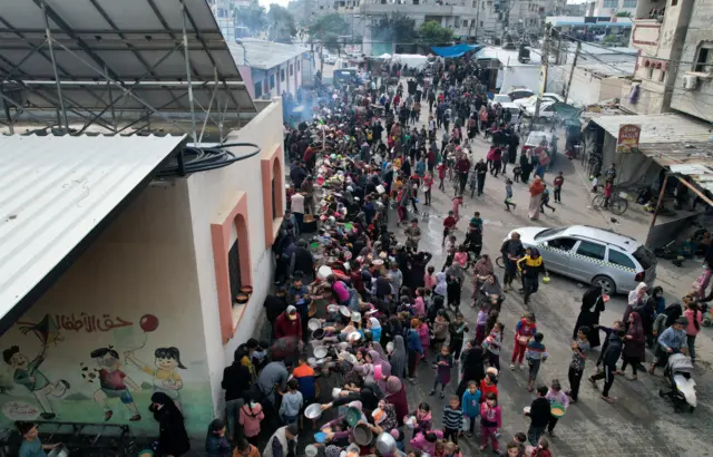 People queuing for food