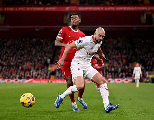 Ryan Gravenberch of Liverpool competing with Sofyan Amrabat of Manchester United