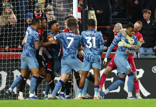 Players clash after Aston Villa's Ollie Watkins scores their second goal