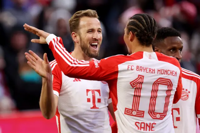 Harry Kane celebrating with Leroy Sane