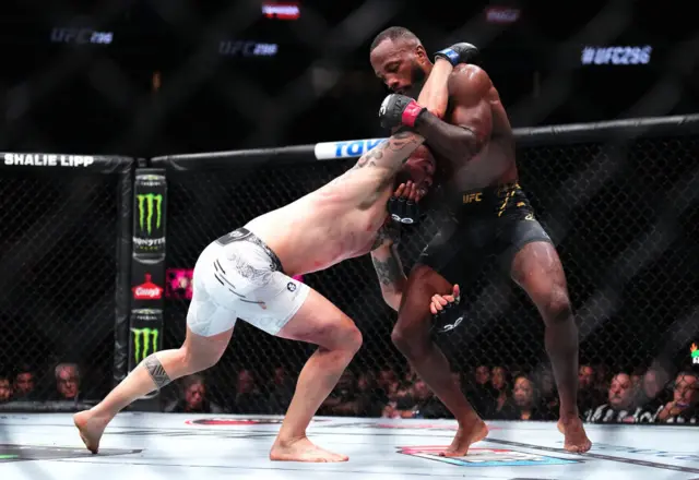 Leon Edwards grapples with Colby Covington