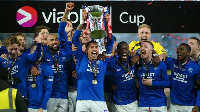 James Tavernier lifts the trophy