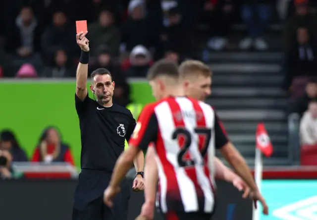 Ben Mee of Brentford is awarded a red card