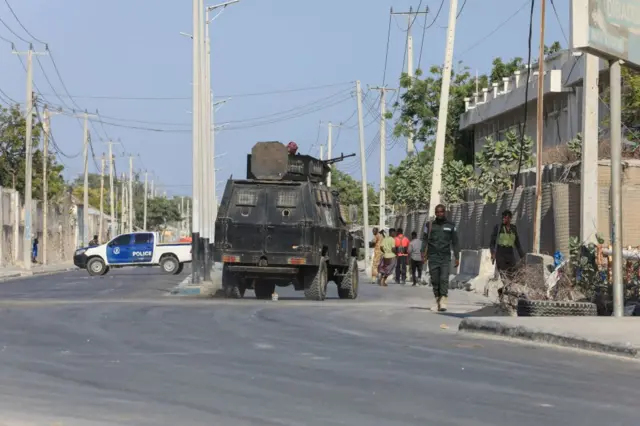 Security forces patrol outside a building which was attacked by suspected Al Shabaab militants in the Somalia's capital Mogadishu, on February 21, 2023.