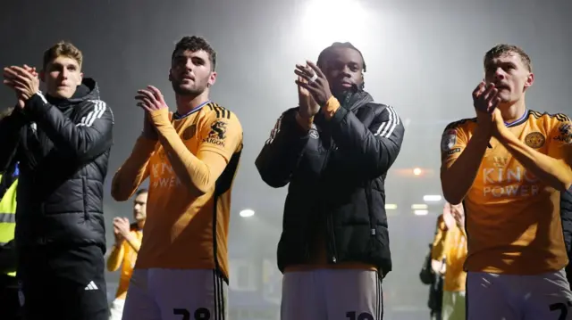 Leicester players applaud fans