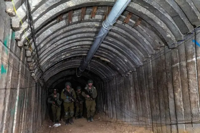 Soldiers walk through the tunnel